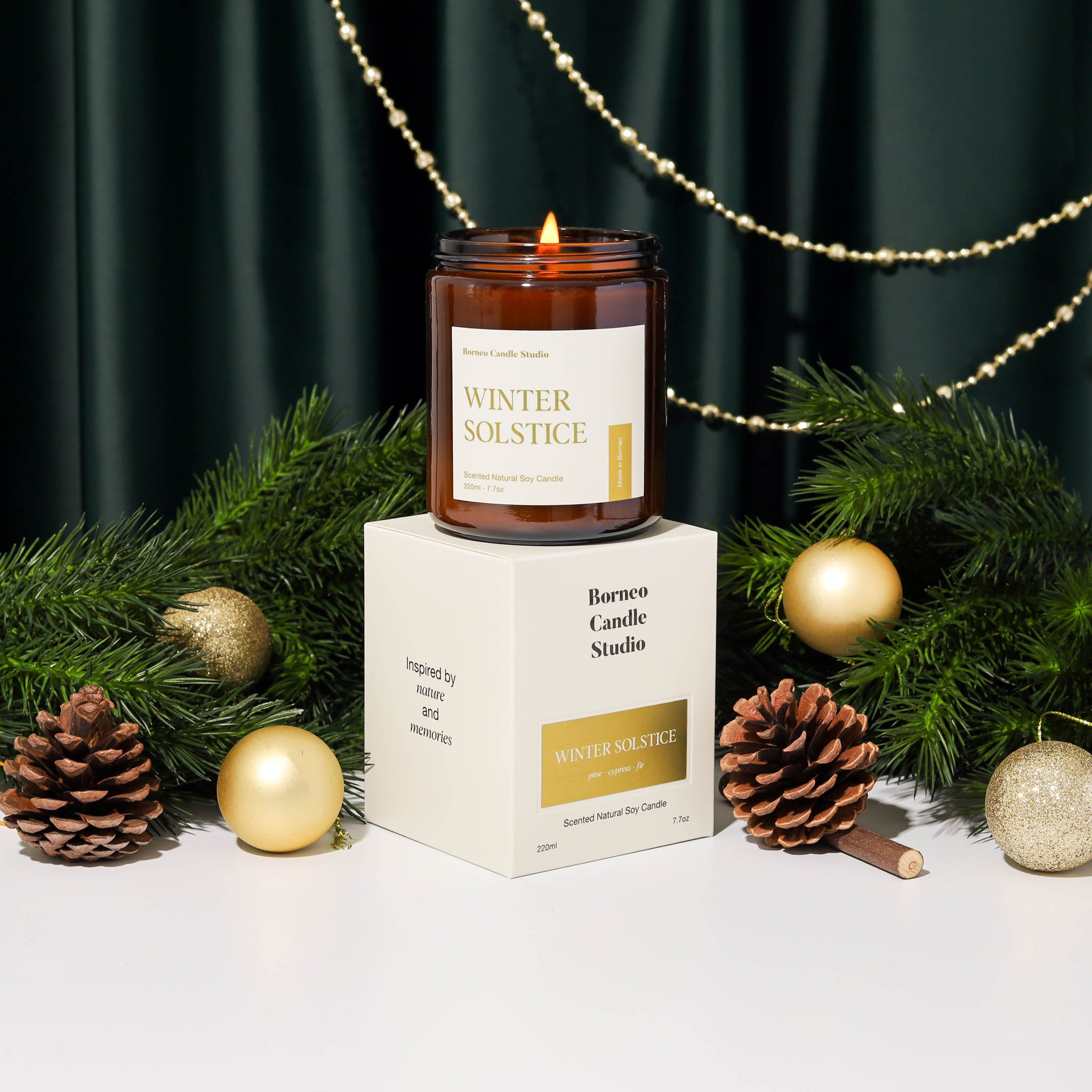 Winter Solstice Holiday Collection Christmas Scented Candle by Borneo Candle Studio Brunei. With scent notes of pine, cypress and fir. Christmas candle with packaging box in gold label